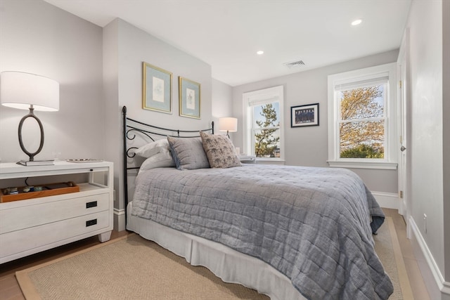 bedroom with light hardwood / wood-style floors