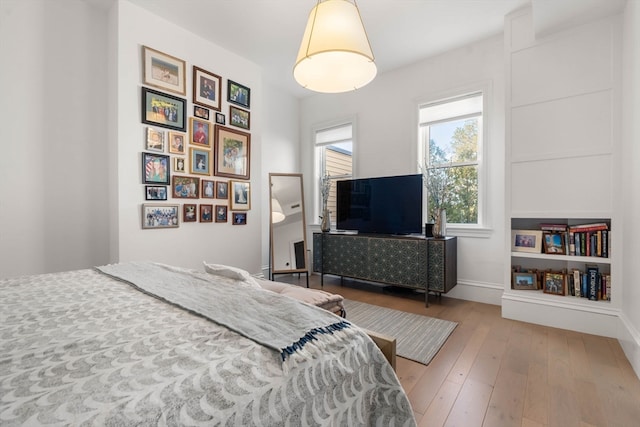 bedroom with hardwood / wood-style flooring