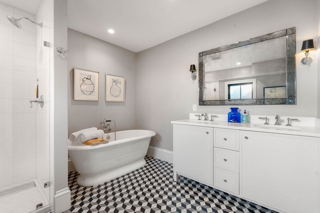 bathroom featuring vanity and separate shower and tub