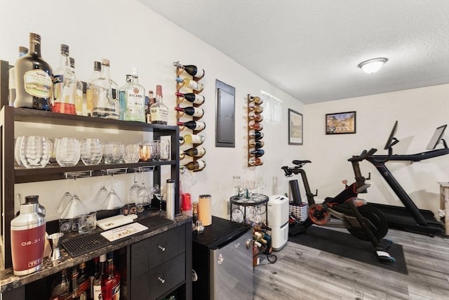 112 Cocasset St Unit 3, Foxboro, MA 02035 - bar featuring light wood-type flooring and a textured ceiling