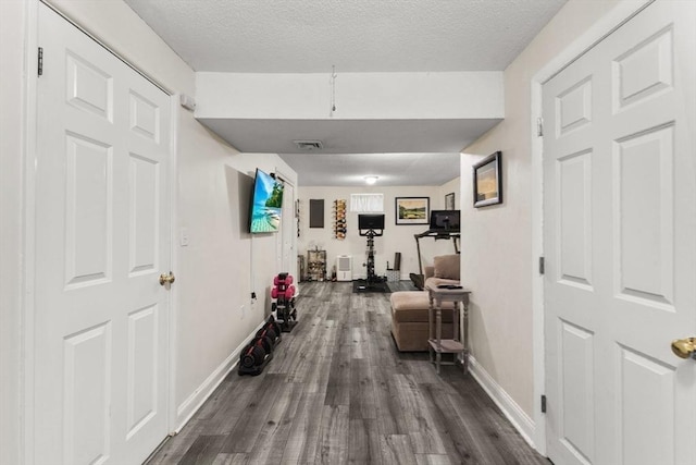 112 Cocasset St Unit 3, Foxboro, MA 02035 - corridor with dark wood-style floors, baseboards, and a textured ceiling