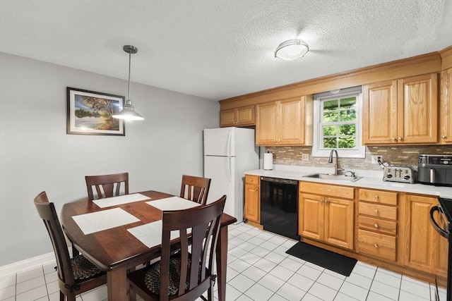 112 Cocasset St Unit 3, Foxboro, MA 02035 - kitchen featuring dishwasher, freestanding refrigerator, a sink, backsplash, and light countertops