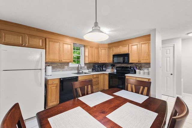 112 Cocasset St Unit 3, Foxboro, MA 02035 - kitchen featuring black appliances, a sink, light countertops, and tasteful backsplash