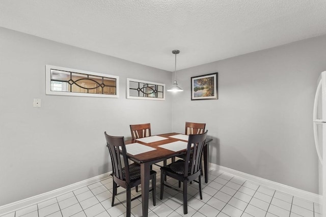 112 Cocasset St Unit 3, Foxboro, MA 02035 - dining space with light tile patterned floors, baseboards, and a textured ceiling