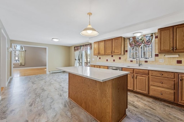 kitchen with brown cabinets, a sink, backsplash, stainless steel dishwasher, and light countertops