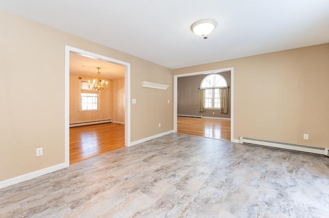 unfurnished room featuring a wealth of natural light, wood finished floors, a baseboard heating unit, and a baseboard radiator