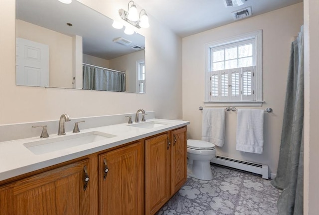 bathroom featuring a sink, toilet, visible vents, and a baseboard radiator