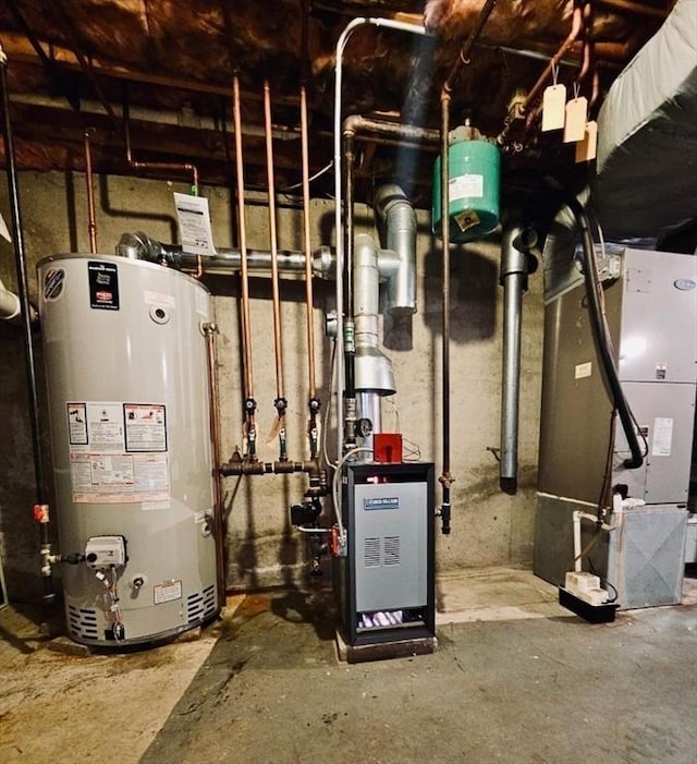 utility room featuring heating unit, a heating unit, and water heater