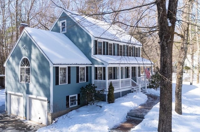 view of front facade with covered porch, a chimney, a garage, and a sunroom