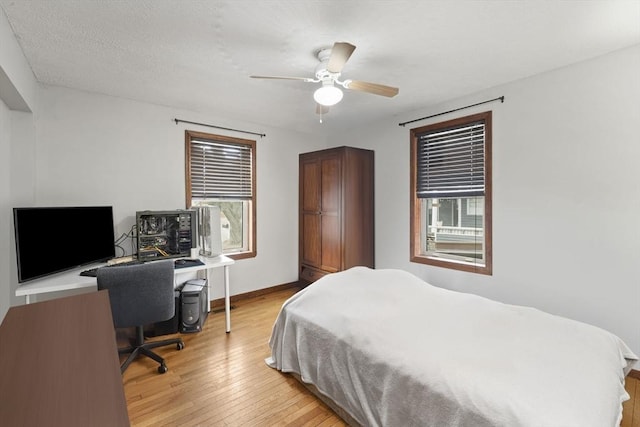 bedroom featuring ceiling fan and light wood-type flooring