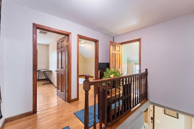 corridor featuring light hardwood / wood-style floors