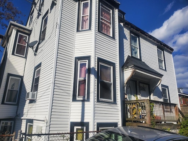 view of side of property with cooling unit