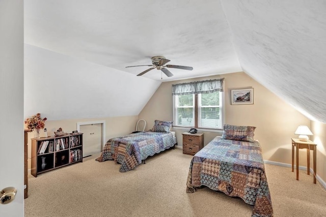 bedroom featuring lofted ceiling, ceiling fan, and carpet