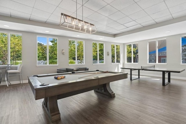 game room with pool table, baseboards, wood finished floors, and a drop ceiling