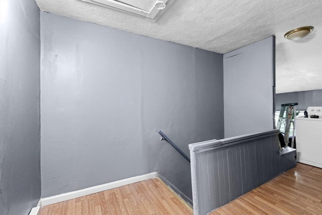 686-688 E Ave, Warwick, RI 02886 - stairs with washer / clothes dryer, wood finished floors, and a textured ceiling