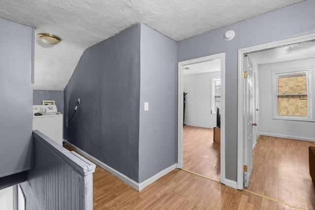 686-688 E Ave, Warwick, RI 02886 - corridor with washer / dryer, light wood-style floors, an upstairs landing, and a textured ceiling