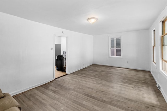 686-688 E Ave, Warwick, RI 02886 - unfurnished room with wood finished floors and baseboards