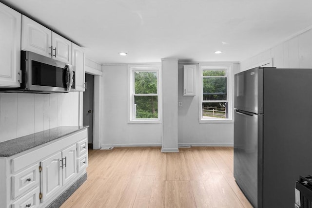 686-688 E Ave, Warwick, RI 02886 - kitchen featuring stainless steel appliances, light wood-type flooring, dark stone counters, white cabinets, and recessed lighting