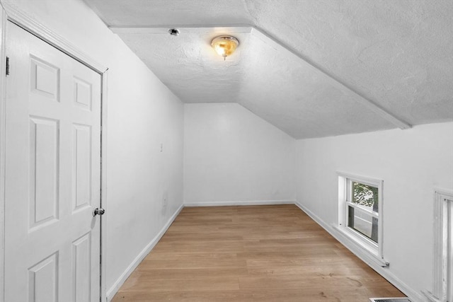 686-688 E Ave, Warwick, RI 02886 - bonus room with a textured ceiling, vaulted ceiling, and light wood-type flooring