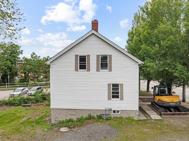 686-688 E Ave, Warwick, RI 02886 - view of side of home featuring a chimney