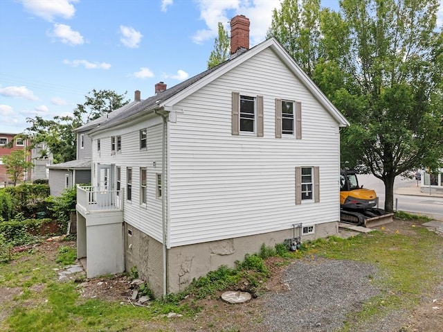 686-688 E Ave, Warwick, RI 02886 - view of side of home featuring a chimney