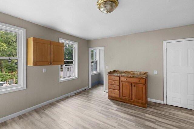 686-688 E Ave, Warwick, RI 02886 - dining area featuring light wood-style floors and healthy amount of natural light