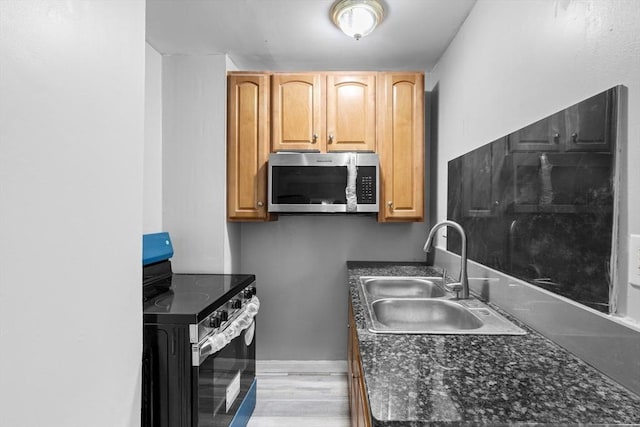 686-688 E Ave, Warwick, RI 02886 - kitchen featuring stainless steel microwave, electric range oven, and light wood-style floors