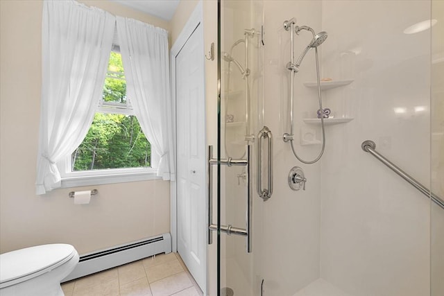 9 Treadwell Ter, Spencer, MA 01562 - full bathroom featuring a baseboard heating unit, a shower stall, tile patterned flooring, and toilet