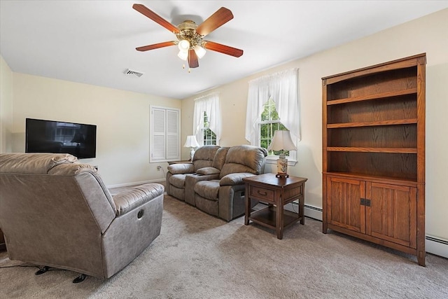 9 Treadwell Ter, Spencer, MA 01562 - living room with light carpet, a ceiling fan, and a baseboard radiator
