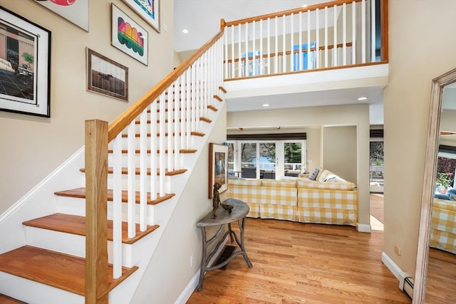 10 Lake Farm Ln, Orleans, MA 02653 - stairs with wood finished floors, baseboards, a towering ceiling, recessed lighting, and a baseboard radiator