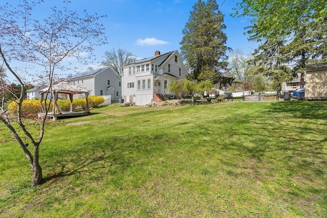 view of yard featuring fence and a gazebo