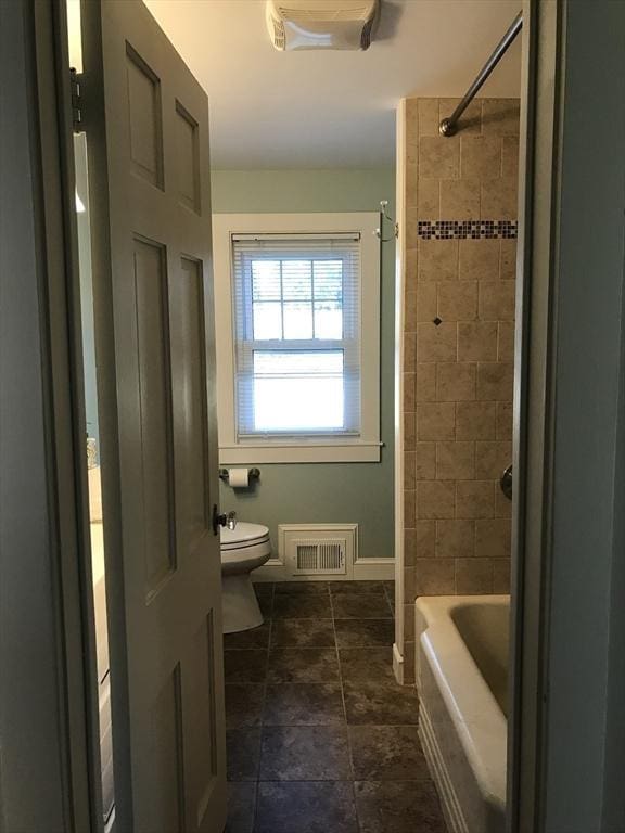 full bath with shower / bathing tub combination, visible vents, toilet, and baseboards