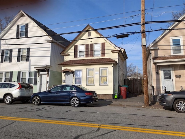 view of front of home featuring fence