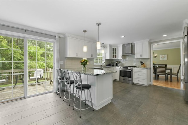 186 Mitchell G Dr, Tewksbury, MA 01876 - kitchen with stainless steel range with electric stovetop, wall chimney range hood, a peninsula, decorative backsplash, and white cabinets