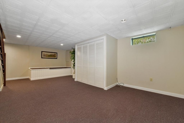 186 Mitchell G Dr, Tewksbury, MA 01876 - basement with dark carpet, baseboards, and recessed lighting