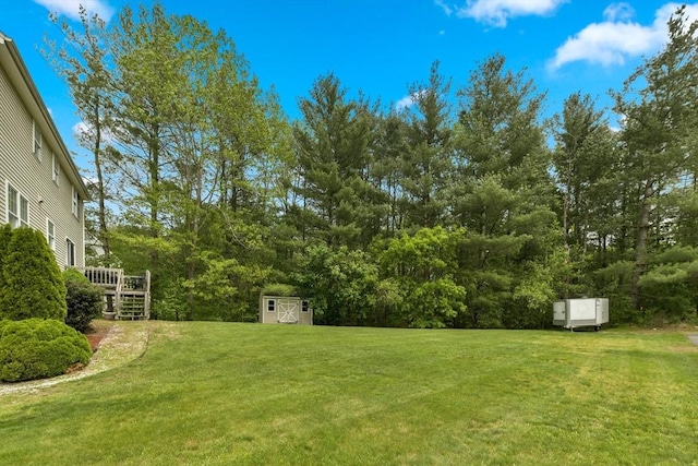 186 Mitchell G Dr, Tewksbury, MA 01876 - view of green lawn featuring a deck and stairs