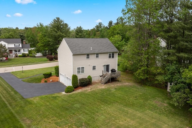 186 Mitchell G Dr, Tewksbury, MA 01876 - view of property exterior featuring asphalt driveway, an attached garage, stairway, a yard, and roof with shingles