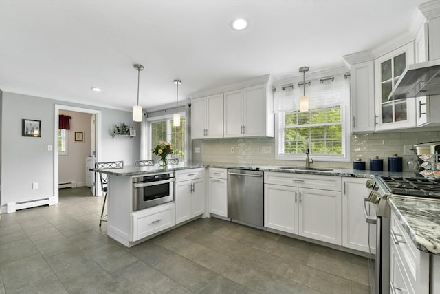 186 Mitchell G Dr, Tewksbury, MA 01876 - kitchen featuring appliances with stainless steel finishes, a peninsula, a baseboard radiator, white cabinets, and a sink