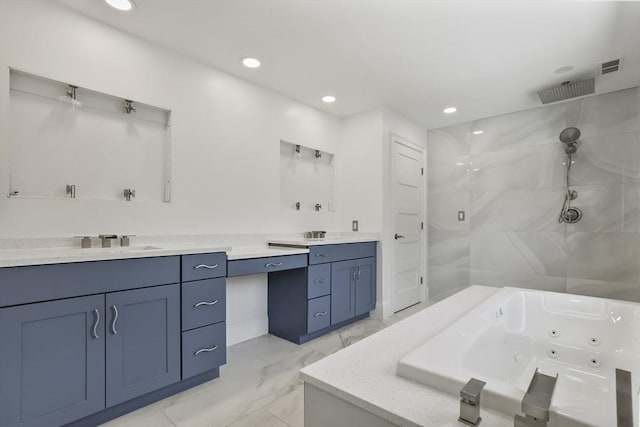 bathroom with vanity and independent shower and bath