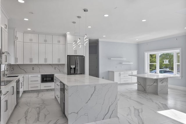 kitchen featuring pendant lighting, white cabinetry, sink, a center island, and stainless steel fridge with ice dispenser