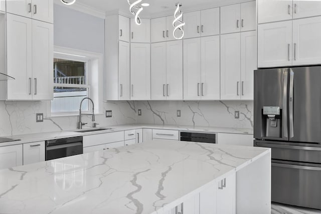 kitchen with white cabinetry, sink, hanging light fixtures, light stone counters, and black appliances