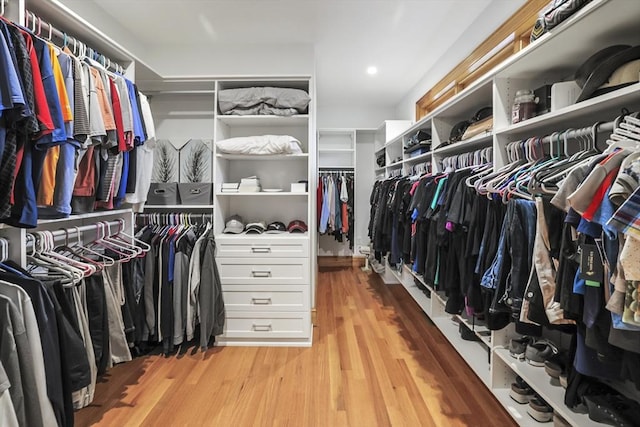 spacious closet with light hardwood / wood-style floors