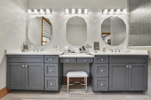 bathroom featuring vanity and wood-type flooring