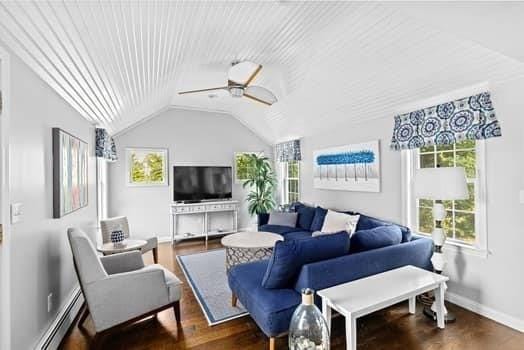 28 Christopher Ln, Scituate, MA 02066 - living room with plenty of natural light, a baseboard radiator, lofted ceiling, ceiling fan, and wood finished floors