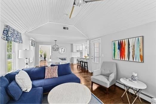 28 Christopher Ln, Scituate, MA 02066 - living area featuring a baseboard radiator, wood finished floors, vaulted ceiling, and wood ceiling