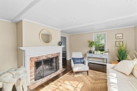 28 Christopher Ln, Scituate, MA 02066 - living area with crown molding, a fireplace, and wood finished floors