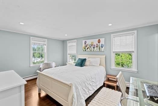 28 Christopher Ln, Scituate, MA 02066 - bedroom featuring baseboard heating, dark wood-style floors, and recessed lighting