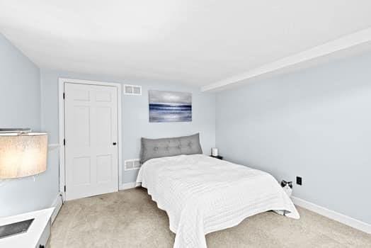 28 Christopher Ln, Scituate, MA 02066 - carpeted bedroom featuring baseboards