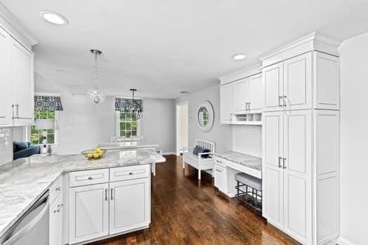 28 Christopher Ln, Scituate, MA 02066 - kitchen featuring stainless steel dishwasher, a peninsula, white cabinetry, dark wood finished floors, and light stone countertops