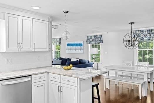 28 Christopher Ln, Scituate, MA 02066 - kitchen with dishwasher, a chandelier, and white cabinetry